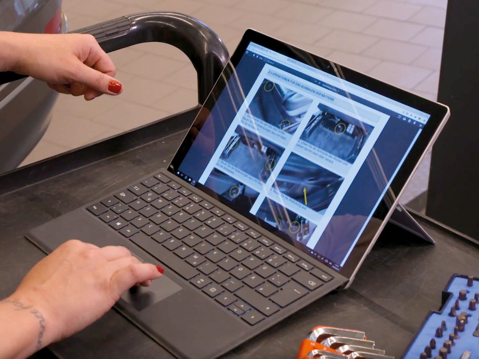 Person viewing instructions on laptop